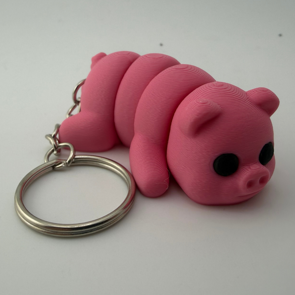 Pink articulated 3D printed pig keychain